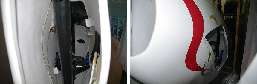 左：中を覗き込むとフレームの後ろに…　右：四角い穴がヒートカッターで開けたという乗り込み口